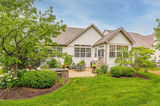 1728 Briarheath Dr, Aurora, IL 60505 - rear view of property with a patio area, a lawn, a shingled roof, and a sunroom