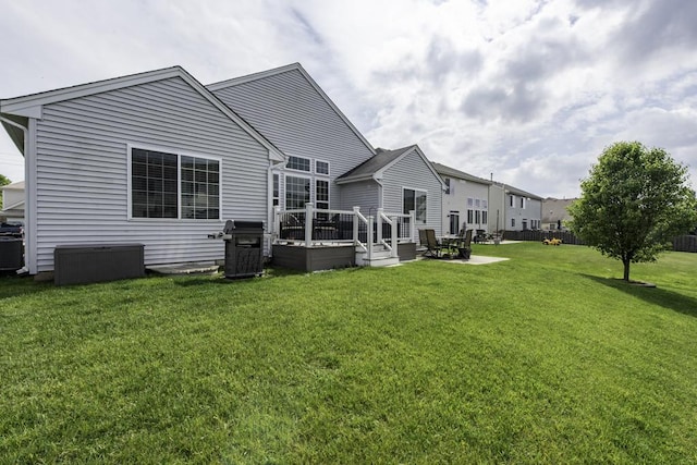 1444 Baroque Ave, Volo, IL 60073 - rear view of house featuring a deck and a lawn