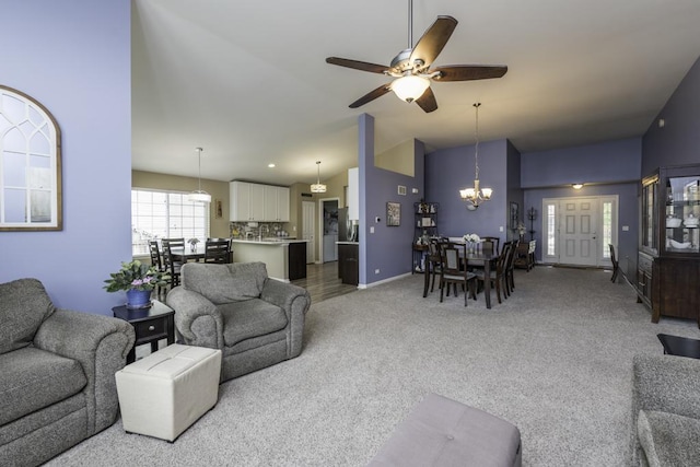 1444 Baroque Ave, Volo, IL 60073 - living room with a chandelier, a ceiling fan, light carpet, and high vaulted ceiling