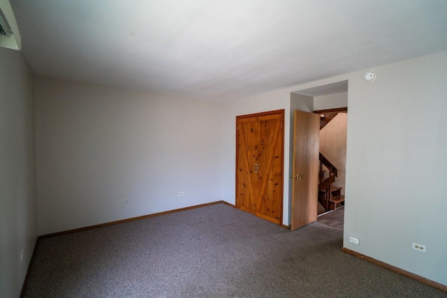 89 Maude Ave Unit A, Fox Lake, IL 60020 - carpeted spare room with stairway and a smoke detector