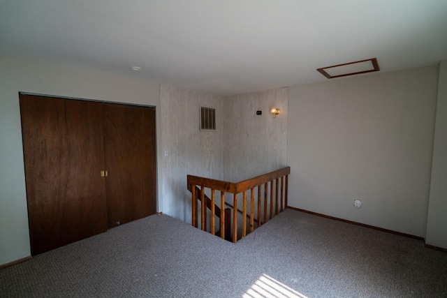 89 Maude Ave Unit A, Fox Lake, IL 60020 - carpeted spare room with attic access and baseboards
