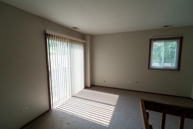 89 Maude Ave Unit A, Fox Lake, IL 60020 - spare room featuring carpet flooring and baseboards