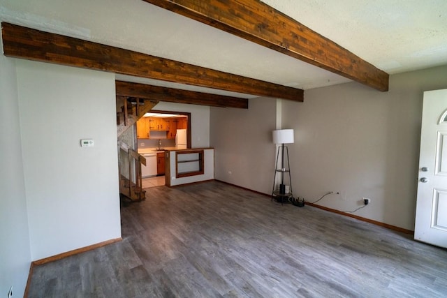 89 Maude Ave Unit A, Fox Lake, IL 60020 - unfurnished living room featuring dark wood finished floors, stairs, and beamed ceiling