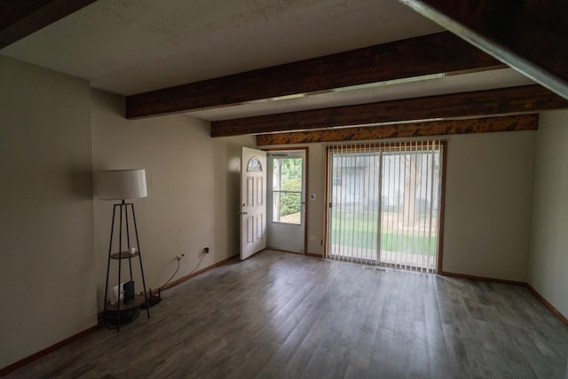 89 Maude Ave Unit A, Fox Lake, IL 60020 - unfurnished living room with wood finished floors and beam ceiling