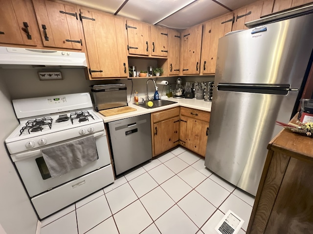 89 Maude Ave Unit A, Fox Lake, IL 60020 - kitchen featuring appliances with stainless steel finishes, under cabinet range hood, light countertops, open shelves, and light tile patterned floors