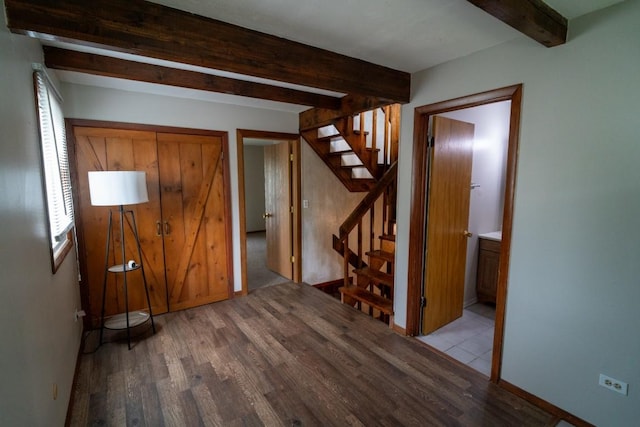 89 Maude Ave Unit A, Fox Lake, IL 60020 - unfurnished bedroom with wood finished floors and beam ceiling