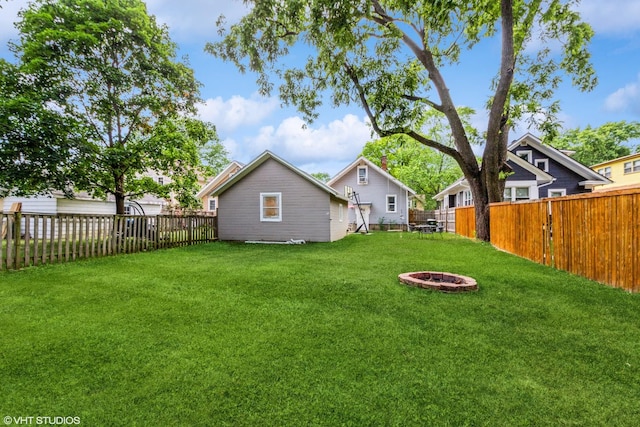 916 Pearl St, Aurora, IL 60505 - fenced backyard featuring an outdoor fire pit
