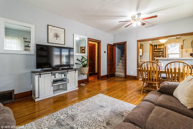 916 Pearl St, Aurora, IL 60505 - living room with stairs, a ceiling fan, and wood finished floors