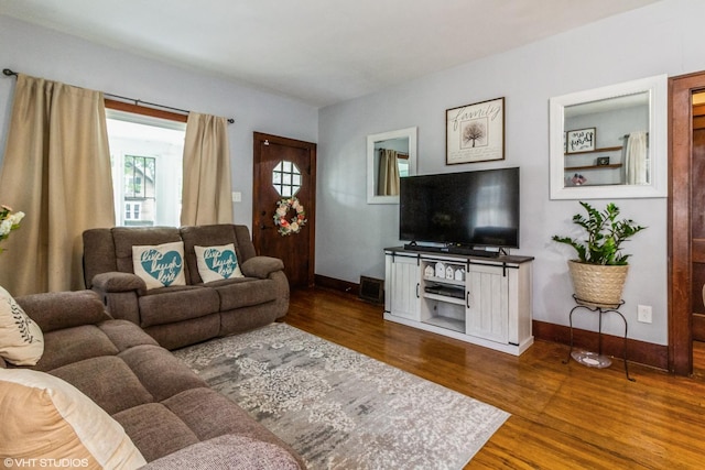 916 Pearl St, Aurora, IL 60505 - living area with dark wood-style floors and baseboards