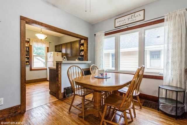 916 Pearl St, Aurora, IL 60505 - dining space featuring light wood-style flooring and baseboards