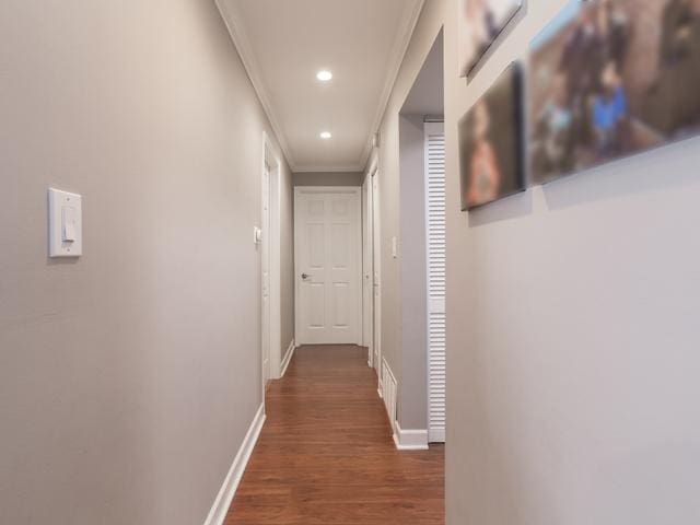 1 Oak Creek Dr Unit 2305, Buffalo Grove, IL 60089 - hallway featuring ornamental molding, dark wood-style flooring, and recessed lighting