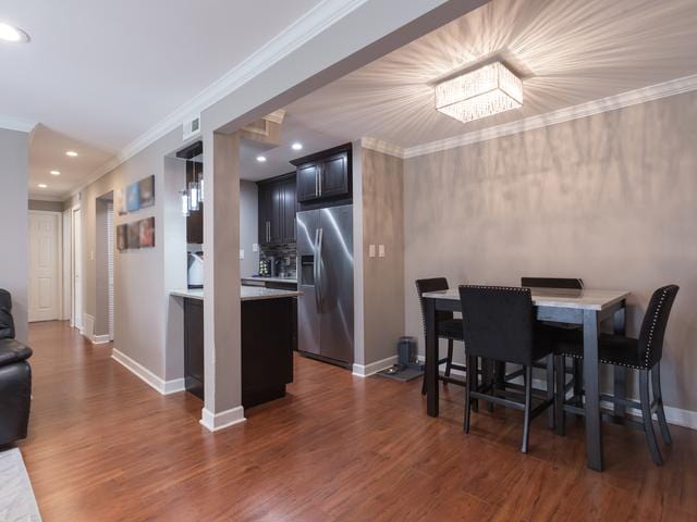 1 Oak Creek Dr Unit 2305, Buffalo Grove, IL 60089 - dining area featuring dark wood-style floors, crown molding, and recessed lighting