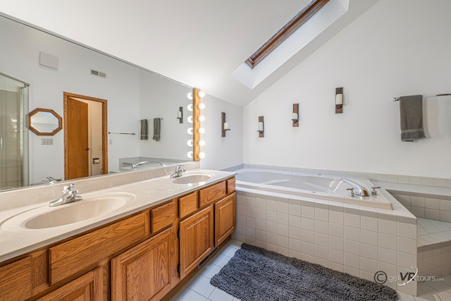 7 Vista Ridge Dr, Galena, IL 61036 - bathroom featuring a skylight, a bath, double vanity, tile patterned floors, and vaulted ceiling