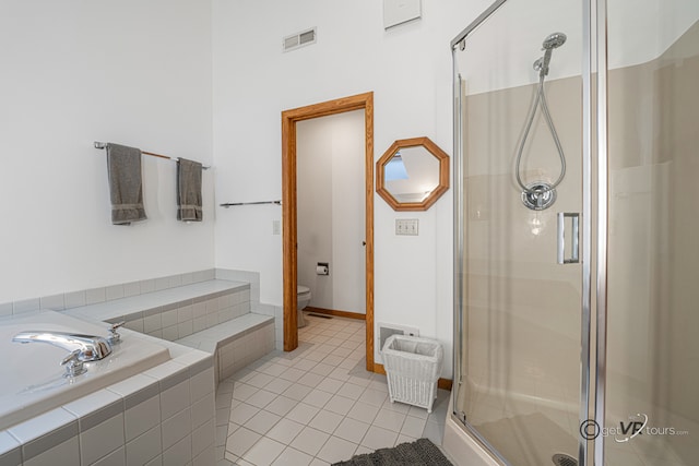 7 Vista Ridge Dr, Galena, IL 61036 - bathroom with a stall shower, a bath, and tile patterned floors