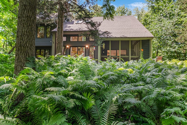 7 Vista Ridge Dr, Galena, IL 61036 - rear view of property with a shingled roof and a sunroom