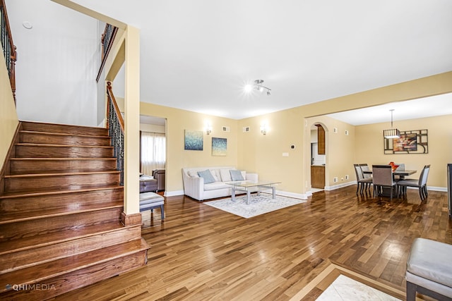 404 W Camp Mcdonald Rd, Prospect Heights, IL 60070 - living room with wood finished floors, arched walkways, and stairs