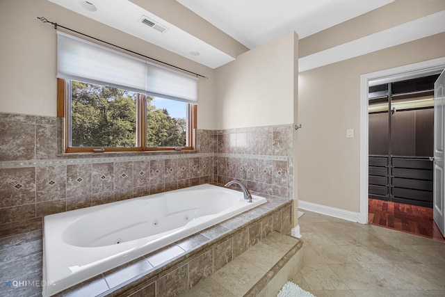 404 W Camp Mcdonald Rd, Prospect Heights, IL 60070 - bathroom with a tub with jets and baseboards