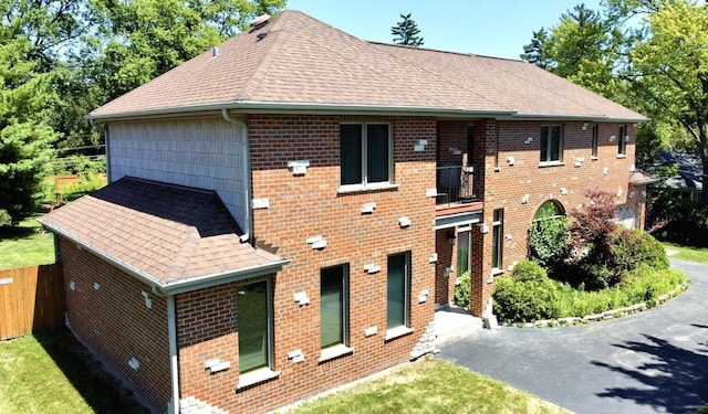 404 W Camp Mcdonald Rd, Prospect Heights, IL 60070 - view of front of home featuring roof with shingles, brick siding, and a balcony
