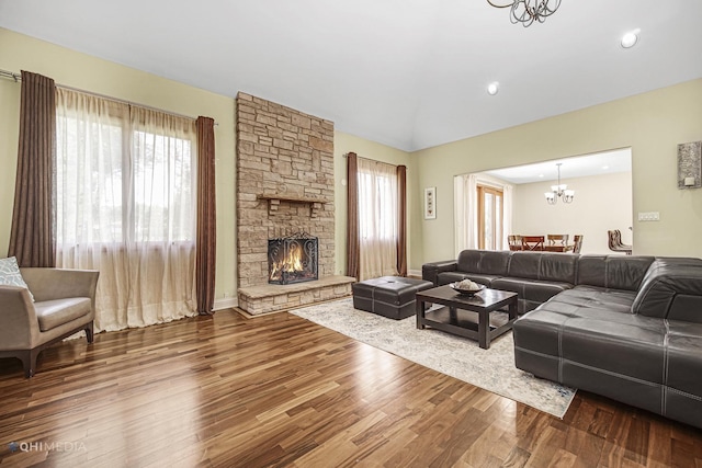 404 W Camp Mcdonald Rd, Prospect Heights, IL 60070 - living area featuring a chandelier, plenty of natural light, wood finished floors, a stone fireplace, and recessed lighting