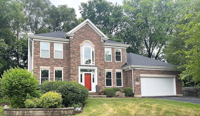 502 Windsor Cir, Fox River Grove, IL 60021 - view of front of property featuring brick siding, driveway, an attached garage, a front lawn, and roof with shingles