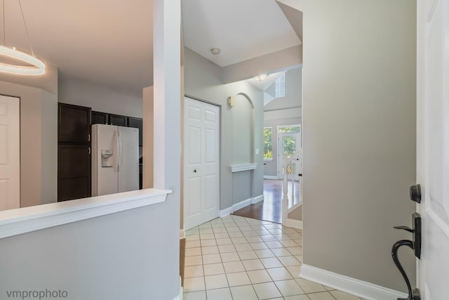 5584 Lavender Ct, Rolling Meadows, IL 60008 - hallway featuring light tile patterned floors and baseboards