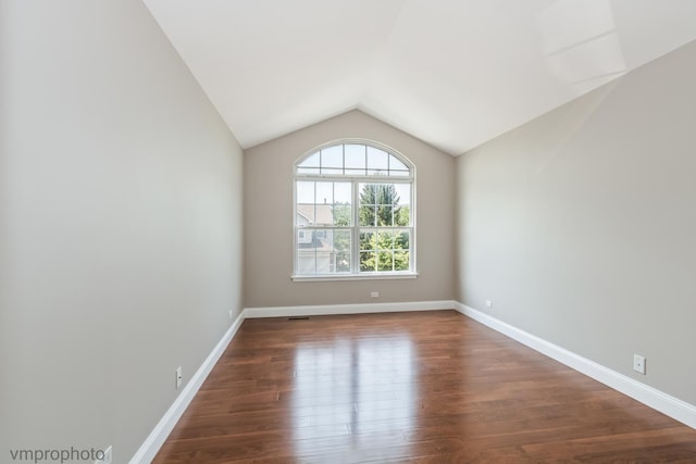 5584 Lavender Ct, Rolling Meadows, IL 60008 - empty room with lofted ceiling and wood finished floors