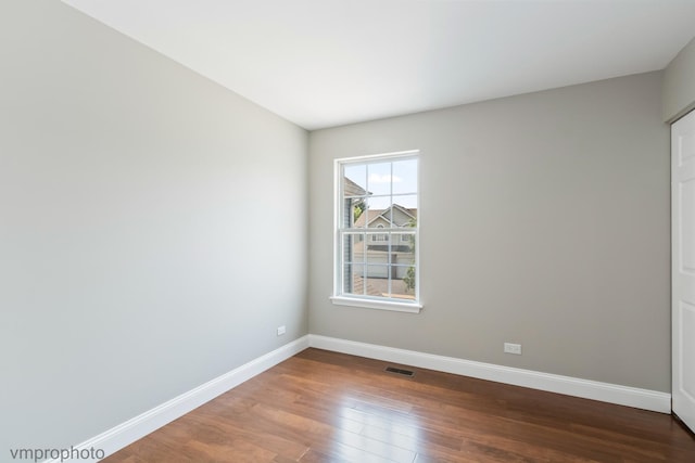 5584 Lavender Ct, Rolling Meadows, IL 60008 - unfurnished room with baseboards and wood finished floors