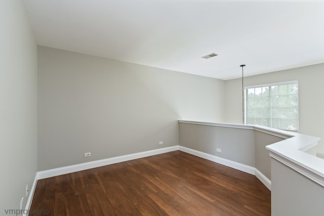 5584 Lavender Ct, Rolling Meadows, IL 60008 - empty room featuring dark wood-style flooring and baseboards