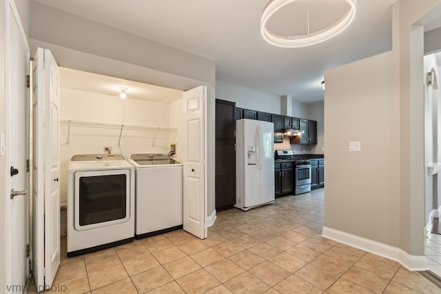 5584 Lavender Ct, Rolling Meadows, IL 60008 - laundry area featuring washer and clothes dryer and light tile patterned floors