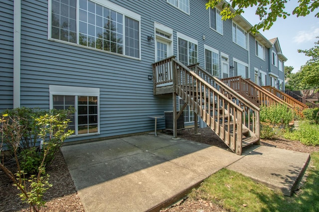 5584 Lavender Ct, Rolling Meadows, IL 60008 - rear view of property featuring a patio and stairway