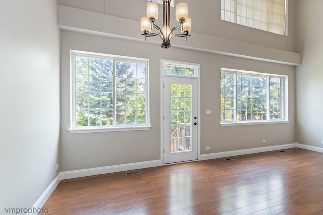 5584 Lavender Ct, Rolling Meadows, IL 60008 - doorway to outside featuring a chandelier and hardwood / wood-style flooring
