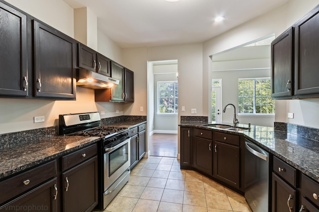5584 Lavender Ct, Rolling Meadows, IL 60008 - kitchen with stainless steel appliances, under cabinet range hood, plenty of natural light, and light tile patterned flooring