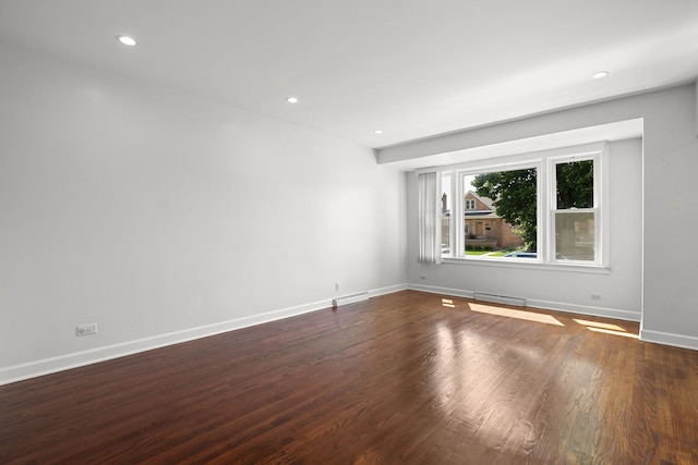 5339 S Kildare Ave, Chicago, IL 60632 - spare room featuring dark wood-type flooring, recessed lighting, and a baseboard heating unit