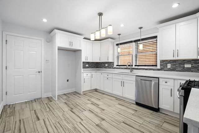 5339 S Kildare Ave, Chicago, IL 60632 - kitchen with stainless steel appliances, decorative backsplash, white cabinets, recessed lighting, and hanging light fixtures