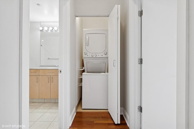 330 N Jefferson St Unit 2102, Chicago, IL 60661 - laundry room featuring stacked washer / drying machine and light wood-type flooring
