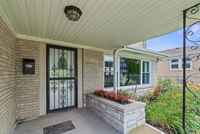 7025 W Berwyn Ave, Chicago, IL 60656 - entrance to property featuring brick siding and a porch
