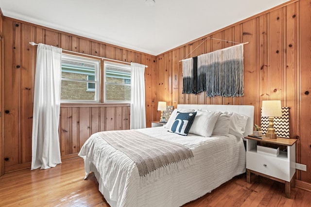 7025 W Berwyn Ave, Chicago, IL 60656 - bedroom featuring wood walls and light wood-type flooring