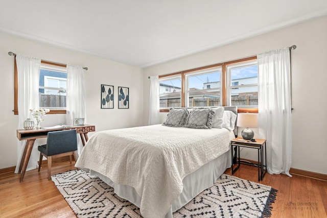 7025 W Berwyn Ave, Chicago, IL 60656 - bedroom with light wood-type flooring and baseboards