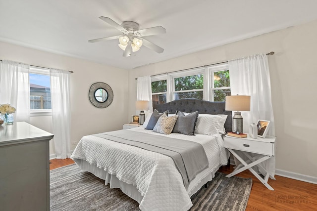 7025 W Berwyn Ave, Chicago, IL 60656 - bedroom featuring multiple windows, wood finished floors, and ceiling fan