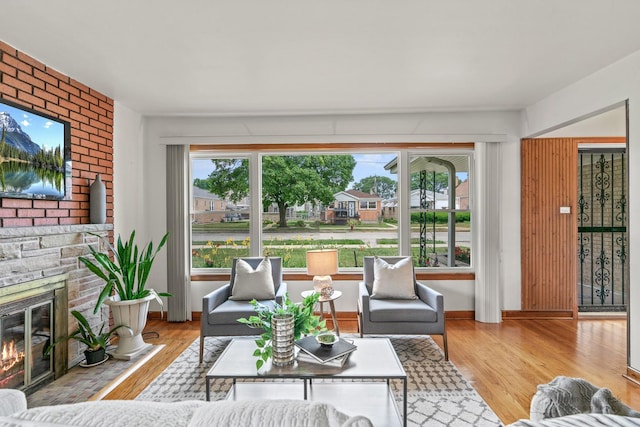 7025 W Berwyn Ave, Chicago, IL 60656 - living area with light wood-type flooring and a large fireplace