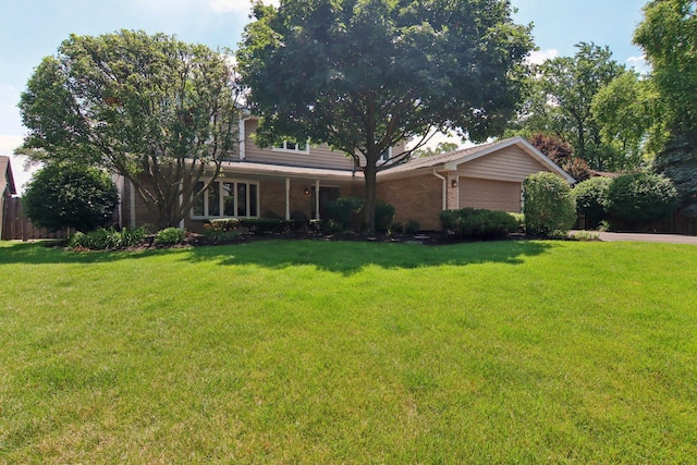 10215 S 87th Ct, Palos Hills, IL 60465 - view of front facade with brick siding, a garage, and driveway