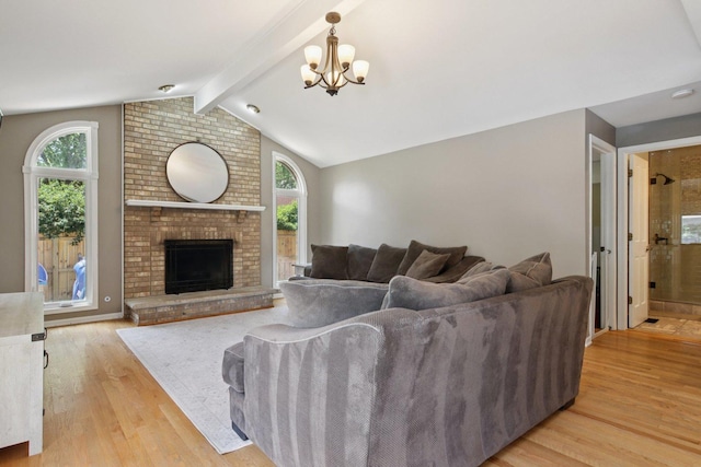 10215 S 87th Ct, Palos Hills, IL 60465 - living room with wood finished floors, a chandelier, and a fireplace