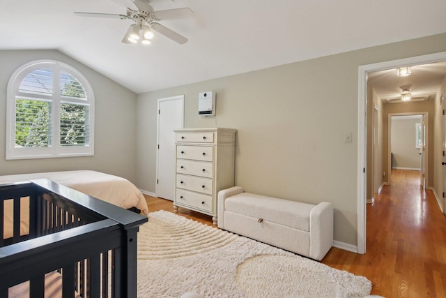 10215 S 87th Ct, Palos Hills, IL 60465 - bedroom with vaulted ceiling, wood finished floors, and a ceiling fan