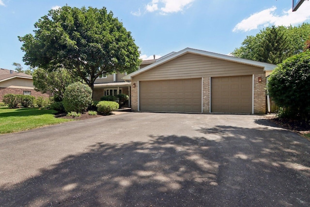 10215 S 87th Ct, Palos Hills, IL 60465 - view of front of home with brick siding and a garage