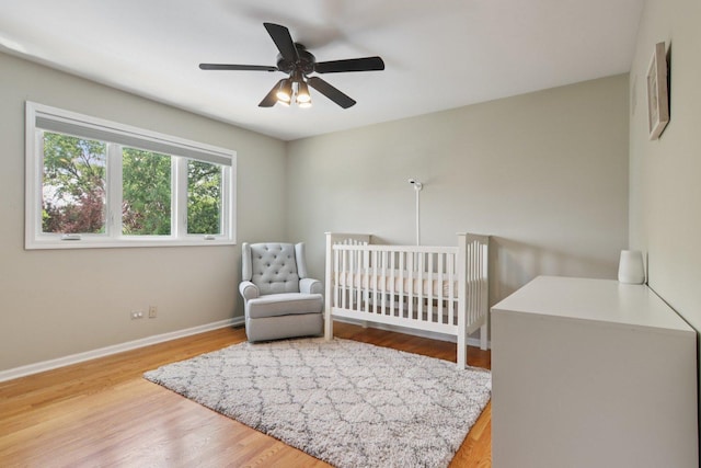 10215 S 87th Ct, Palos Hills, IL 60465 - bedroom with wood finished floors, a crib, and ceiling fan