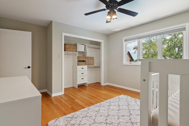 10215 S 87th Ct, Palos Hills, IL 60465 - bedroom featuring light wood-style floors, two closets, and ceiling fan