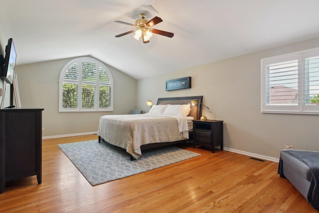 10215 S 87th Ct, Palos Hills, IL 60465 - bedroom with light wood-style floors, vaulted ceiling, and a ceiling fan