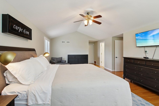 10215 S 87th Ct, Palos Hills, IL 60465 - bedroom with wood finished floors, vaulted ceiling, and a ceiling fan