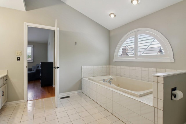 10215 S 87th Ct, Palos Hills, IL 60465 - full bath featuring a whirlpool tub, vanity, tile patterned floors, and lofted ceiling