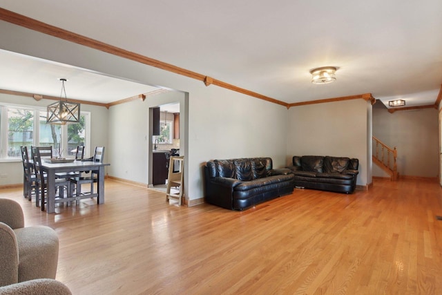 10215 S 87th Ct, Palos Hills, IL 60465 - living area with light wood-style floors, stairs, crown molding, and a chandelier